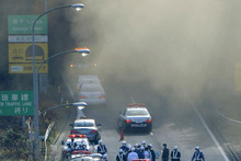 Smoke billows out of the Sasago Tunnel on the Chuo Expressway in Koshu, Yamanashi Prefecture, central Japan after part of the tunnel collapsed. Photo / AP