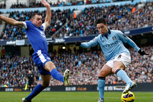 Manchester City's Samir Nasri, right, fights for the ball against Everton's Darron Gibson during their English Premier League soccer match. Photo / Getty Images.