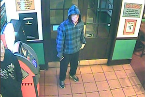 This man is among those thought responsible for armed robberies at five bars or restaurants in eastern Auckland. Photo / Supplied