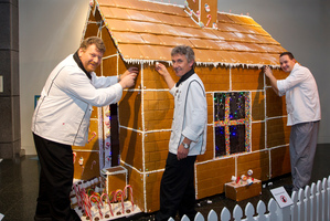 Te Papa chefs (from left) Bernd Lippmann, Paul Limacher and Tom Brinkel decorate their gingerbread creation. Photo / Mark MItchell