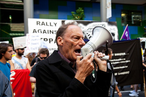 Veteran activist John Minto in action at the anti-TPPA protest. Photo / Neville Marriner