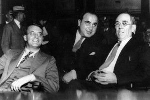 Al Capone, with his defence attorneys Michael Ahern (left) and Albert Fink (right), had plenty of reasons to smile. Photo / Supplied