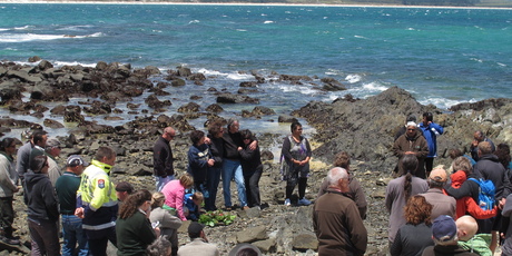 Friends, family members and colleagues gather at Maraewhiti Point for the ceremony. Photo / Peter de Graaf