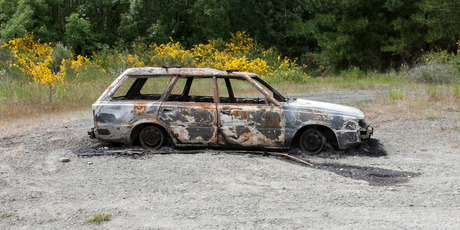 This 1989 silver Subaru station wagon was found burnt-out and with a body inside yesterday afternoon. Photo / supplied