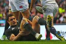 Dan Carter lies down on the ground following an England try at Twickenham. Photo / Getty Images