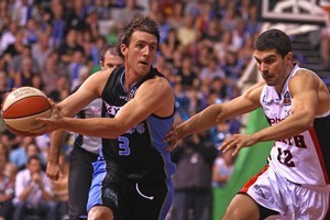Daryl Corletto of the Breakers runs the ball past Kevin Lisch of the Wildcats. Photo / Getty Images
