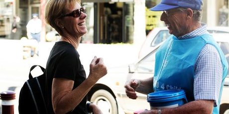 Are friendly charity collectors like Rotary volunteer Ken Linkhorn (r) being pushed aside by hustling chuggers? Photo / Janna Dixon