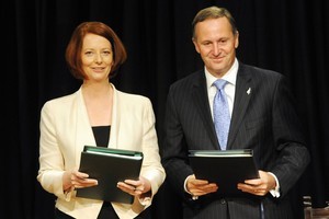 Australian Prime Minister Julia Gillard and New Zealand Prime Minister John Key last year signed an agreement to increase investment between the two countries. Photo / NZPA - Ross Setford