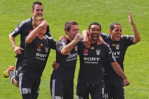 Paul Ifill of the Phoenix celebrates with his team after scoring against the Melbourne Heart. Photo / Getty Images