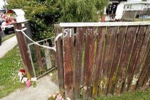 Flowers and cards were left for the family who lived in the Maxwell St house on Durie Hill that was extensively burned early on Tuesday afternoon. Photo / Wanganui Chronicle