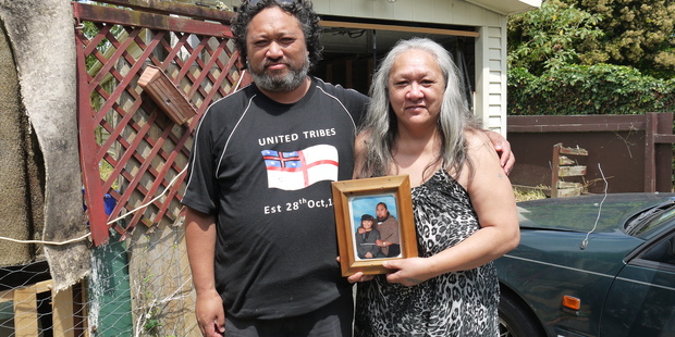 Nicholas Harris' mother Te Enga and his brother Brendon with a photo of Nicholas at their Manurewa home. Photo / Cassandra Mason