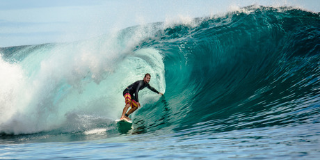 Surf's up in Tahiti, one of French Polynesia's many picturesque islands. Photo / Pierre Lesage