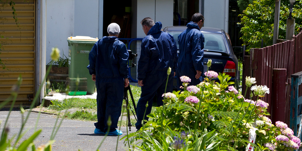 Police detectives working at the scene of a suspicious death in Papakura. Photo / Sarah Ivey