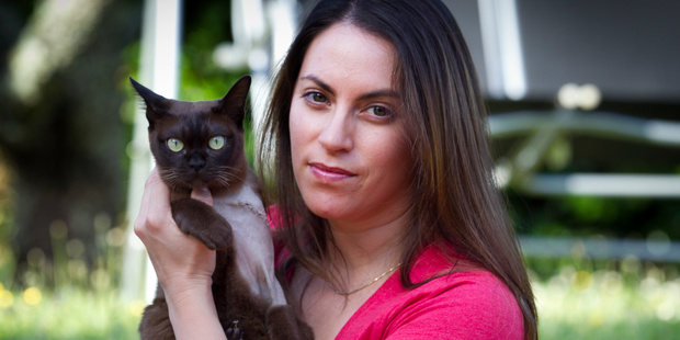 Vanessa Wheeler with her cat Senna, who has a pellet in her shoulder after being shot with an airgun by an unknown attacker. Photo / Natalie Slade