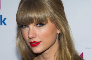 Harry Styles and Taylor Swift had a great time in England. Photo / AP Harry Styles and Taylor Swift had a great time in England. Photo / AP
