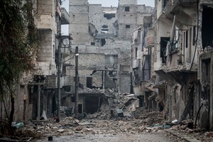 Damaged buildings are seen along a desolate street on the front line after several weeks of intense battles between rebel fighters and troops loyal to Syrian President Bashar al-Assad Aleppo, Syria. Photo / AP