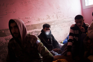 Syrian army solider defectors are seen in a temporary prison, as Free Syrian Army fighters investigate their identity. Photo / AP
