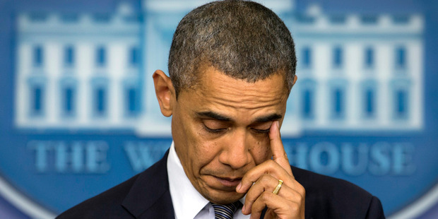 President Barack Obama wipes his eye as he talks about the Connecticut elementary school shooting. Photo / AP