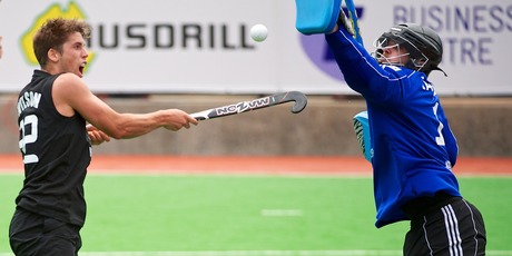 Black Sticks Nick Wilson contests possession with Germany's Nicolas Jacobi. Photo / Photosport