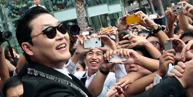 Psy with fans in Bangkok. Photo/AP