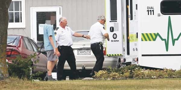 Ambulance staff help a Tamatea Intermediate school student into an ambulance. Photo / Paul Taylor