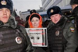 People picket parliament's lower chamber, to protest against planned debate of an amendment that would ban Americans from adopting Russian children.
