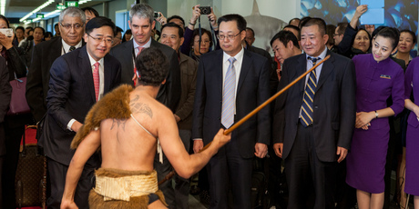 China Southern Airlines' boss Tan Wan'geng and a contingent including business leaders and travel agents are greeted at Auckland Airport. Photo / Supplied