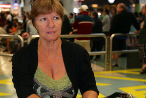 Diann Thompson arriving home at Auckland Airport from Samoa after tropical Cyclone Evan. Photo / Doug Sherring