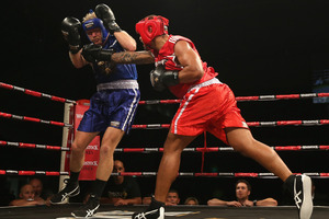 Manu Vatuvei lands a blow against Eric Murray. Photo / Getty Images