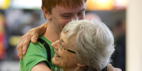 A hug for Cynthia Landels from grandson Mikael Landels, whom she hasn't seen for three years, after his arrival from Sweden. Photo / Steven McNicholl
