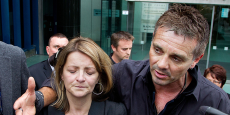 Sue Hollows and her husband, Heath, speak of their anguish outside the court. Photo / Marty Melville