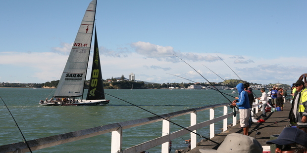 The surfcasters lining the footpaths in the city catch a lot of fish. Photo / Geoff Thomas
