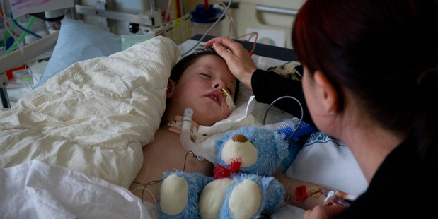 Seven-year-old tetanus victim Alijah Williams with his mother, Linda, at the Starship children's hospital yesterday. Photo / Sarah Ivey