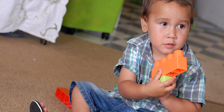 Ozyris Beeching, 2, at home in Edgecumbe a year on from when he was savaged by a dog after wandering next door with his new toy lawnmower. Photo / Lani Hepi