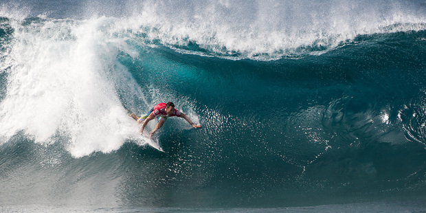 Joel Parkinson of Coolangatta, Australia pulls into the barrel at Pipeline on his road to claiming the world surfing title. Photo / AP