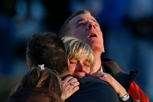 The families of victims grieve near Sandy Hook Elementary School. Photo / AP