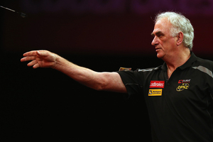 Dave Harrington in his preliminary round match during day six of the 2013 Ladbrokes.com World Darts Championship. Photo / Getty Images