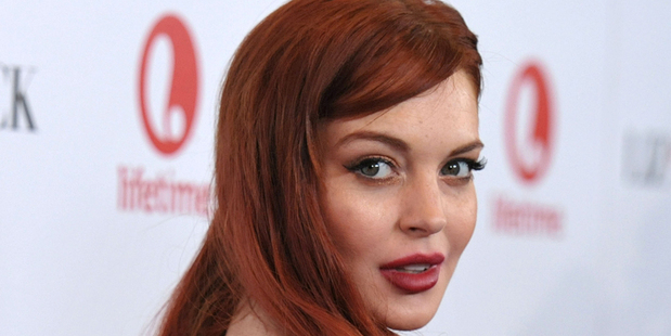Lindsay Lohan on the red carpet for Liz & Dick. Photo/AP