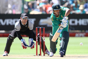 Henry Davids of South Africa and Brendon McCullum of New Zealand in action during the 3rd T20 International match. Photo / Getty