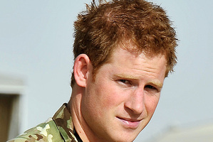Britain's Prince Harry gives a thumbs up after he walked past the Apache flight-line at Camp Bastion in Afghanistan.Photo / File