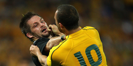 Brothers, not: Richie McCaw and Quade Cooper. Photo / Getty Images