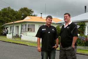 Michael Ross (left) and his brother Craig outside the Tirarau St house (left) where the attack occurred. The already angry crowd went berserk after a child was inadvertently hit with pepper spray. Photo / Brett Phibbs
