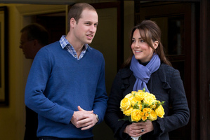 Prince William stands next to his wife Kate, Duchess of Cambridge as she leaves hospital.Photo / AP