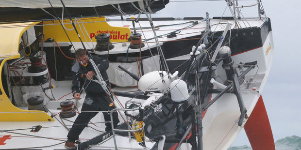 Swiss skipper Bernard Stamm sails after crossing the starting line of the Vendee Globe sailing race. Photo / AP