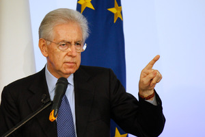 Italian Premier Mario Monti gestures as he speaks during a news conference in Rome. Photo / AP