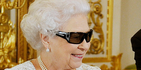 The Queen watches the recording of her Christmas message to the Commonwealth, which was broadcast in 3D for the first time. Photo / AP