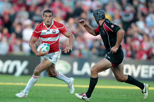 Japan's Ryan Nicholas seeks to evade Canada's Scott Franklin in a 2011 Rugby World Cup clash at McLean Park. Photo / Richard Robinson