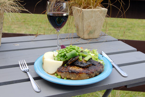 Research suggests the humble potato may counteract some of the harmful effects of charred red meat. Photo / NZPA
