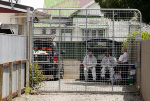 Police at the house in Whakatu after the women suffered serious burns. Photo / Glenn Taylor
