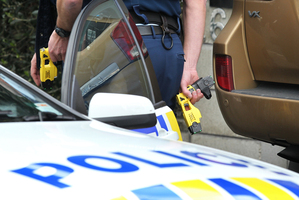 One woman used a brick as a weapon and then tried to shoot the officer with his own taser. Photo / File / Greg Bowker